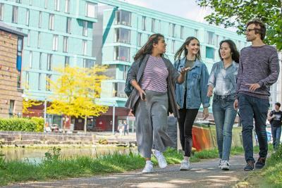 Students walking along canal