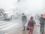 Photograph: A street in New York with heavy vapour from the underground