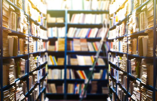 Shelves filled with books in a library.