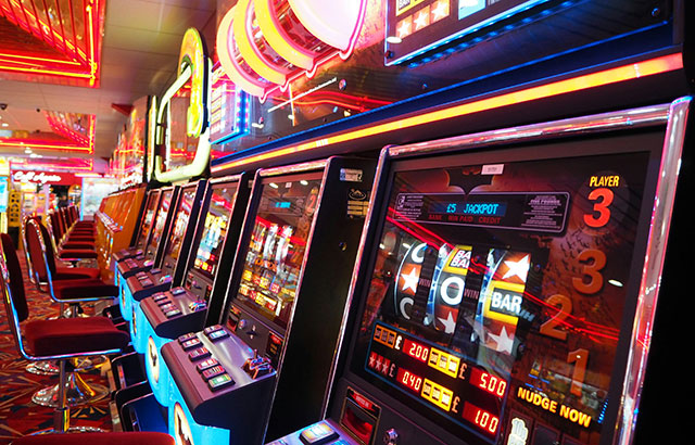 A row of slot machines at a British casino.