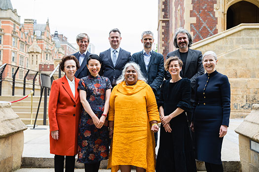 Members of the Queen Mary Intellectual Property Research Institute standing on the steps of Lincoln's Inn.