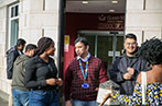 A group of Queen Mary postgraduate law students talking outside the Centre for Commercial Law Studies.
