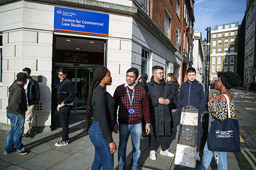 Queen Mary postgraduate law students standing outside the Centre for Commercial Law Studies in central London.