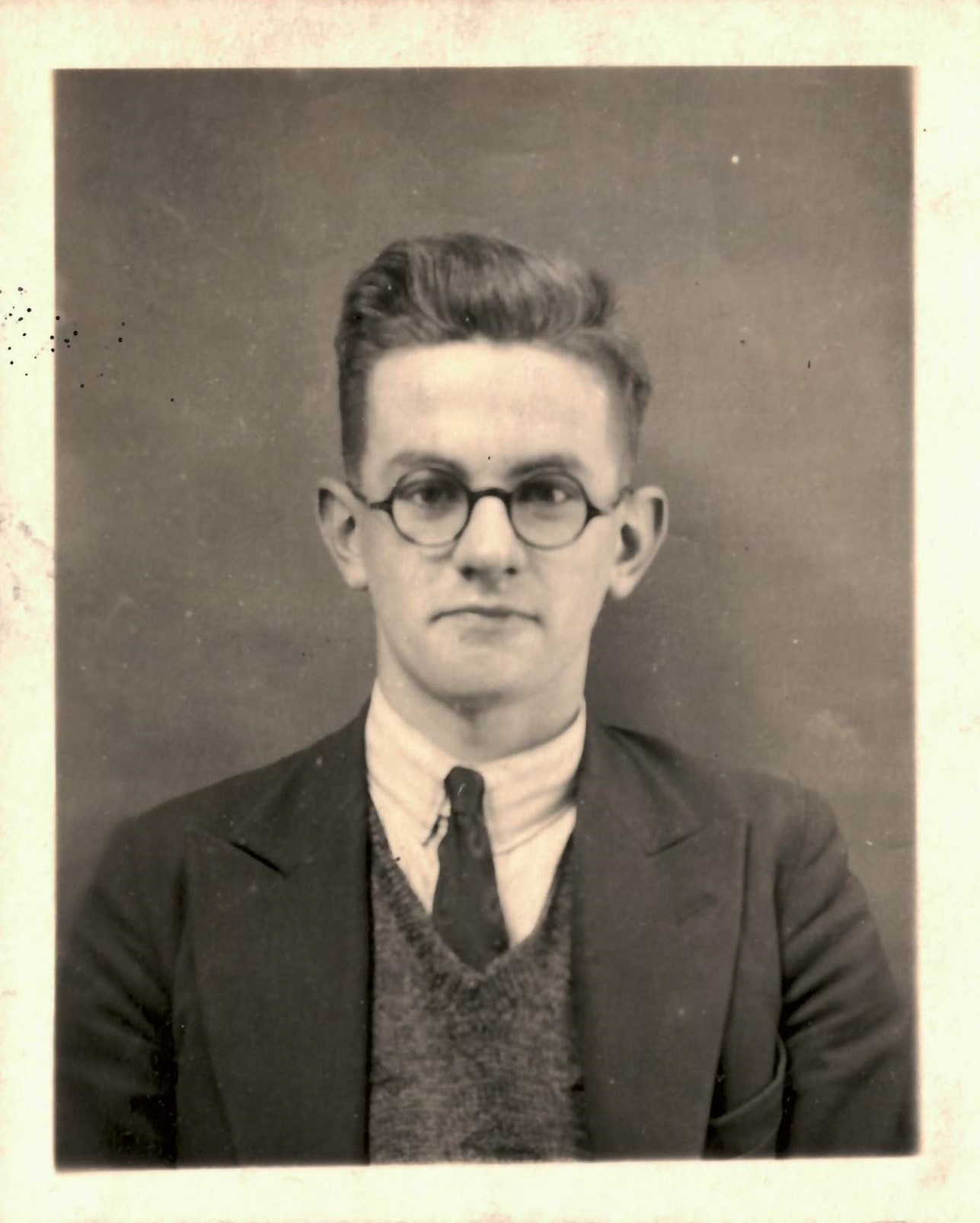 Photograph of blonde boy with glasses