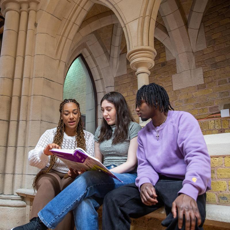 Students looking at reading materials at the Whitechapel Library