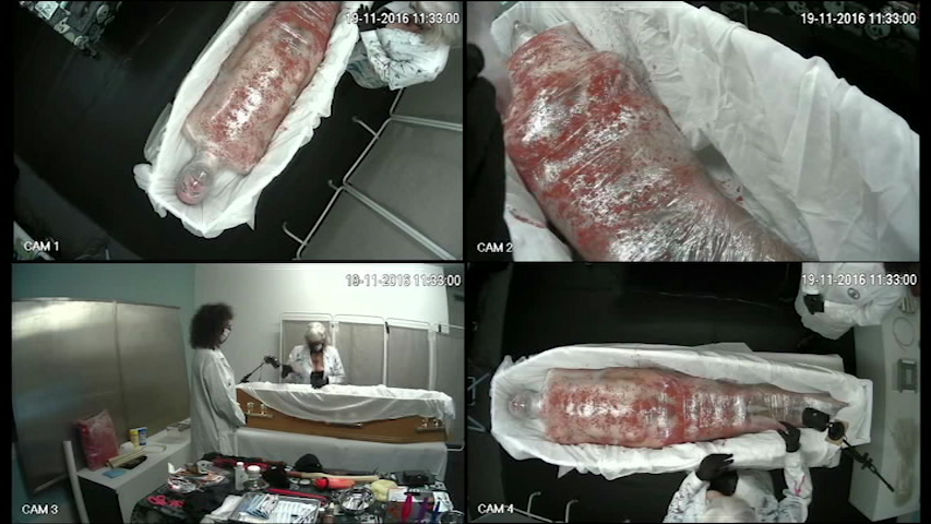 Martin OBrien wrapped in Clingfilm, in a coffin.