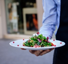 A plate of food being carried