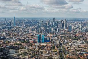 An aerial image looking over east London with The Royal London Hospital in the centre and The City of London in the background