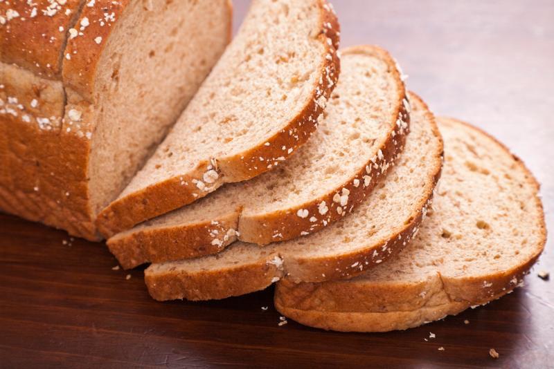 Sliced bread on a wooden surface